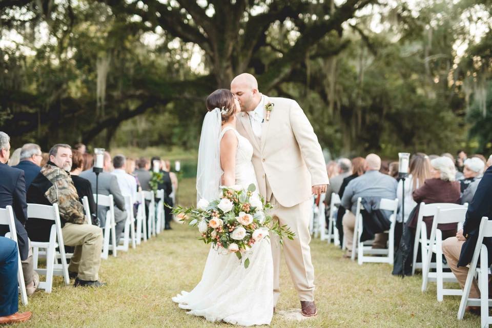 Couple kissing at their wedding